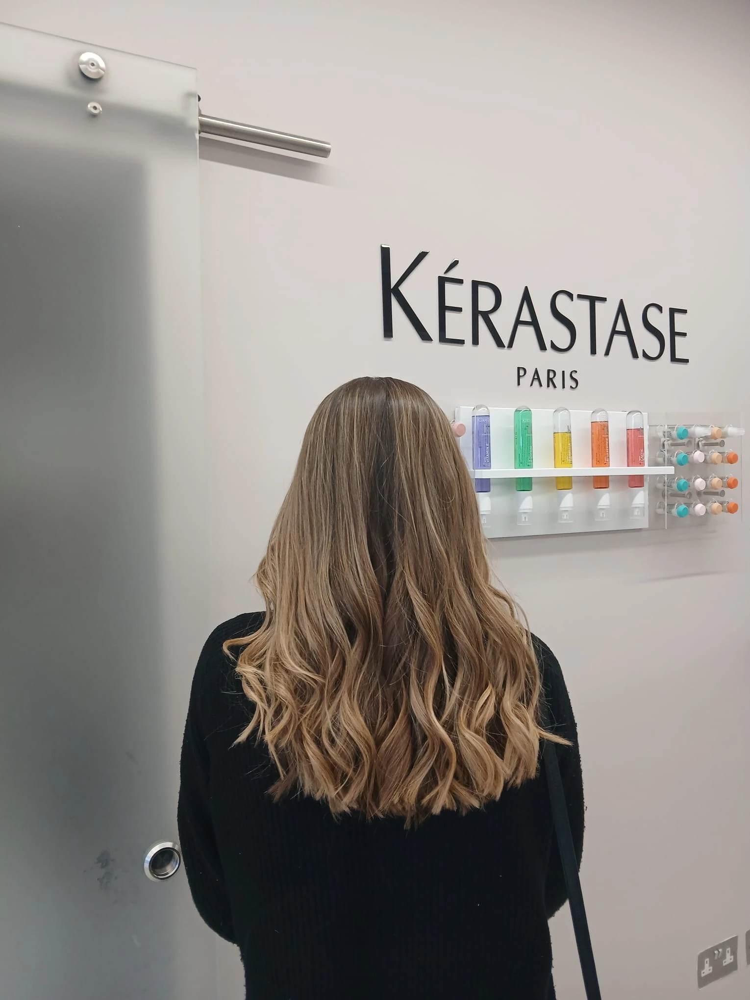 Long blonde balayage melting from a deeper root by Bobby, L'Oréal Certified Colour Specialist at The Village Edit, Wimbledon Village