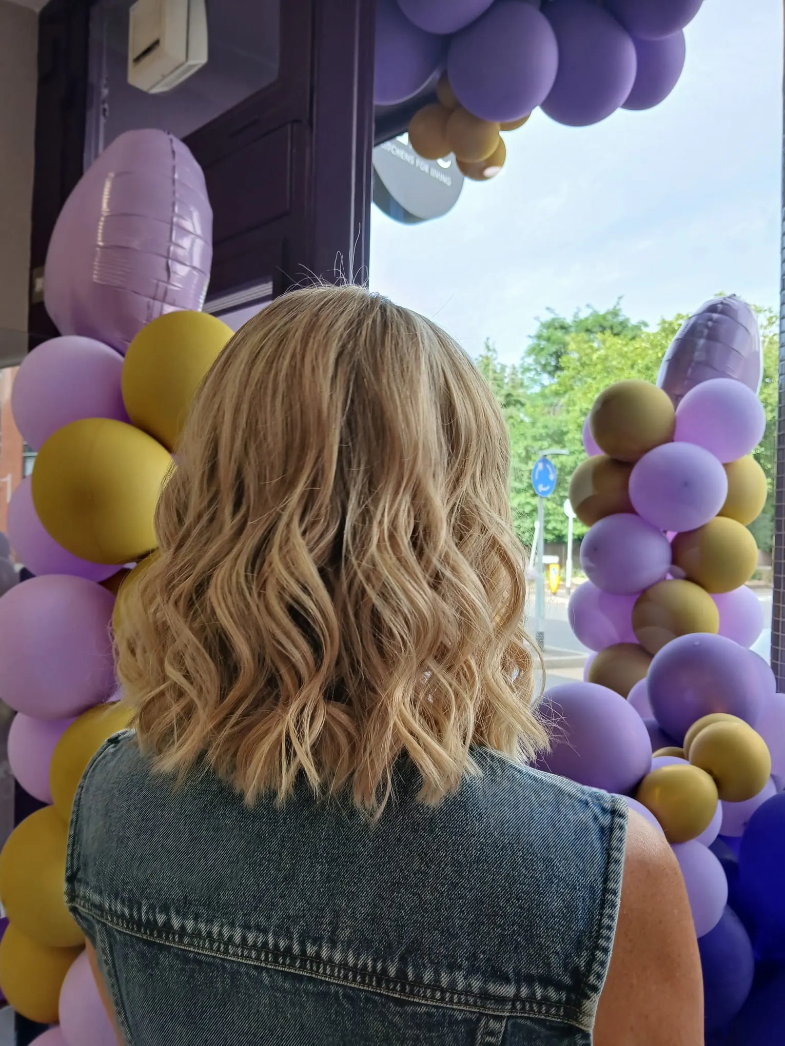 Shoulder-length blonde balayage with soft waves by Bobby, L'Oréal Certified Colour Specialist at The Village Edit, Wimbledon Village