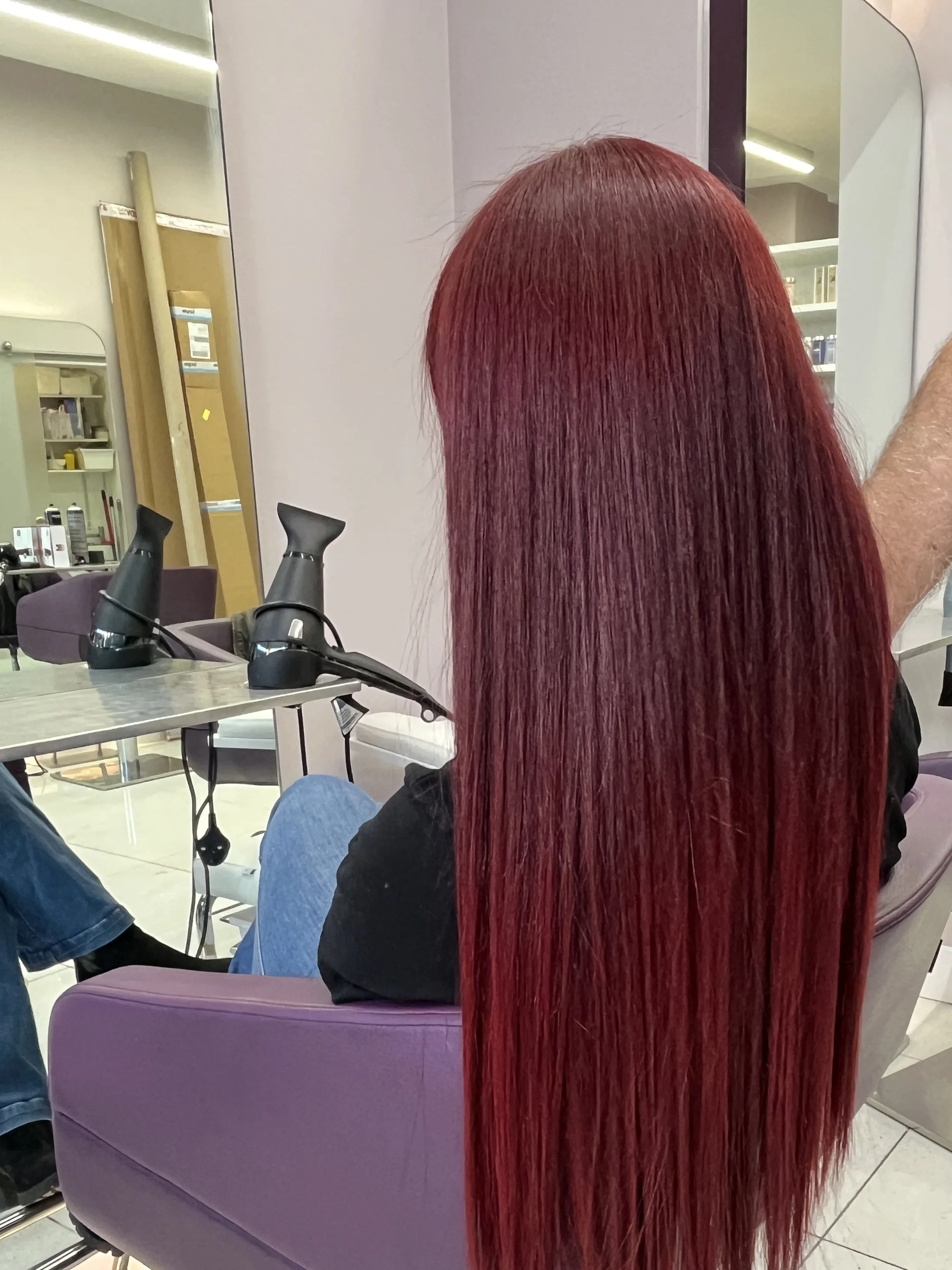 Long red hair colour with a rich, high-shine finish by Bobby, L'Oréal Certified Colour Specialist at The Village Edit, Wimbledon Village