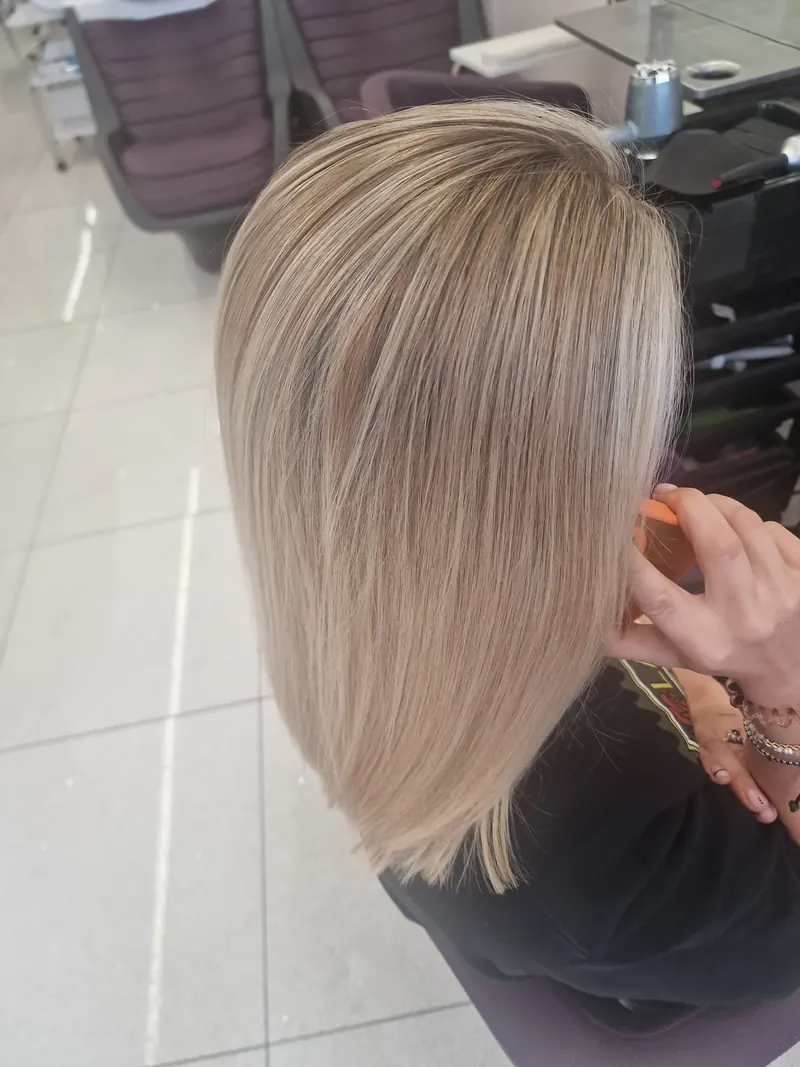 Full head of blonde highlights, cool and glossy, by Bobby