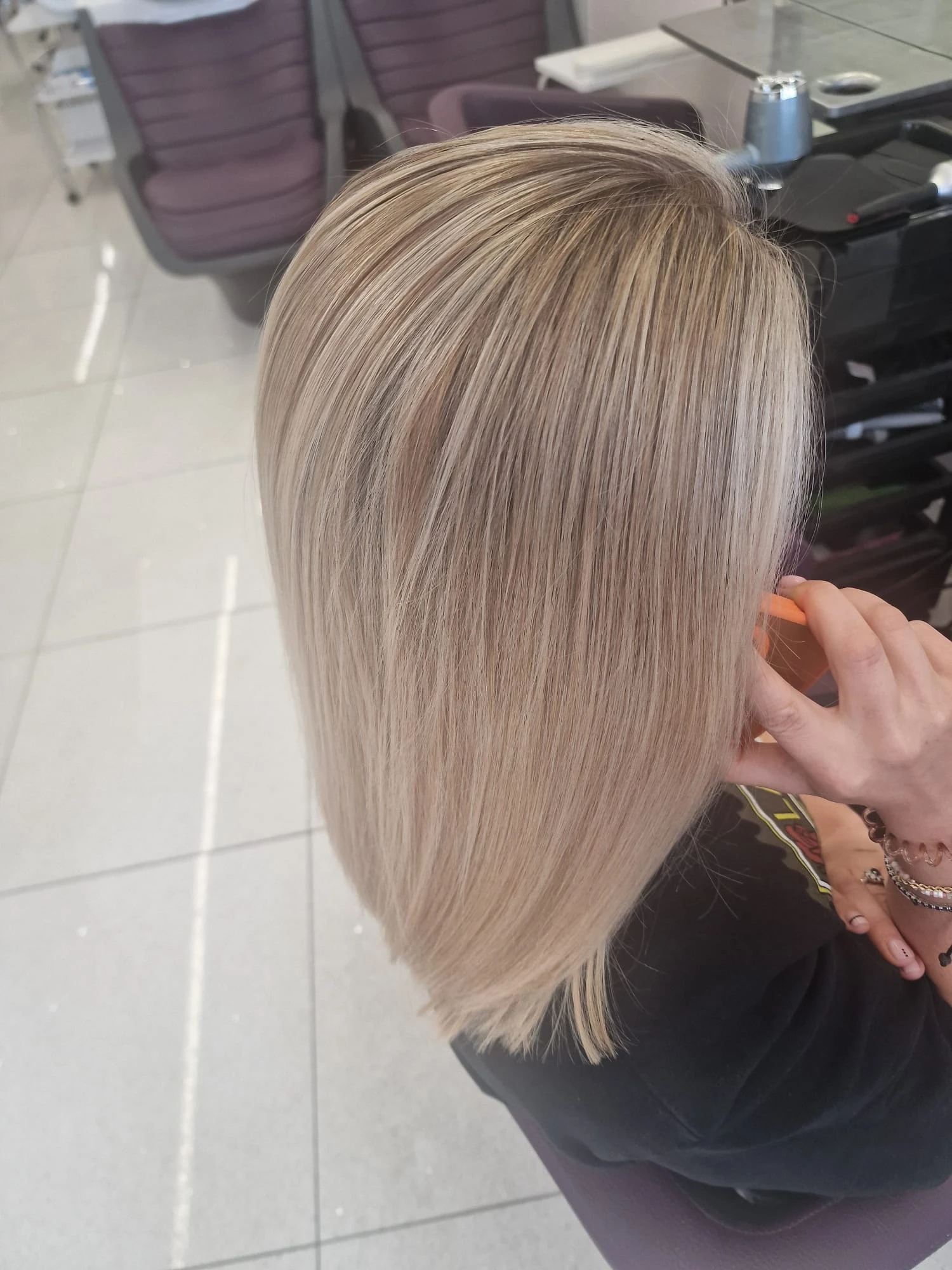 A finished full head of cool blonde highlights by Bobby, L'Oréal Certified Colour Specialist at The Village Edit, Wimbledon Village